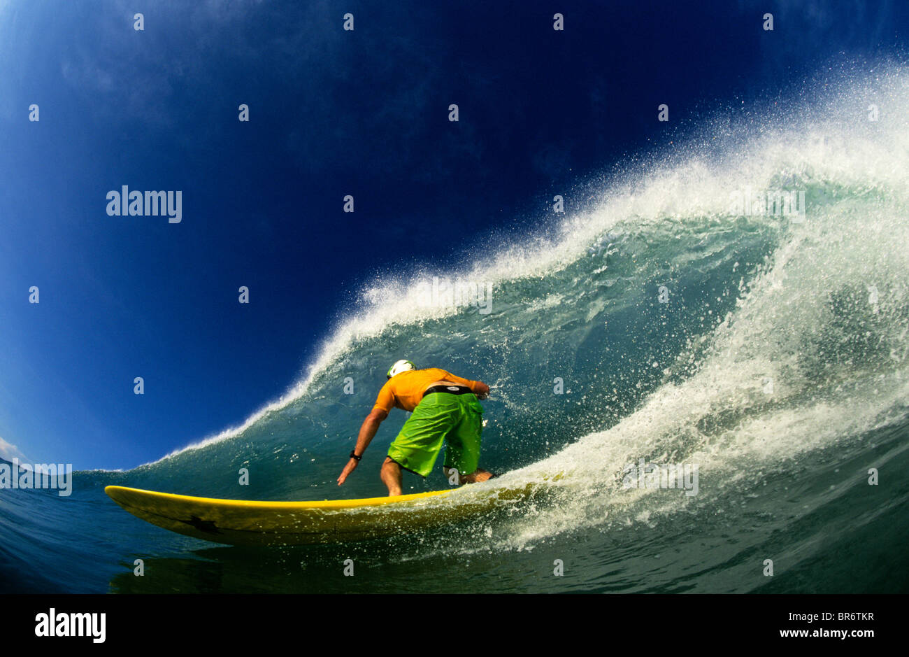 Longboard surfer bottom turning at the Mexican Pipeline. (fisheye Stock Photo Alamy