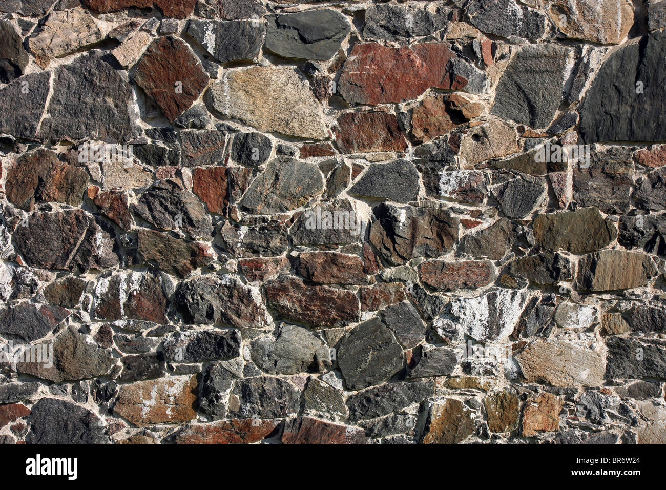 Textured background image showing an old stone wall pattern Stock Photo