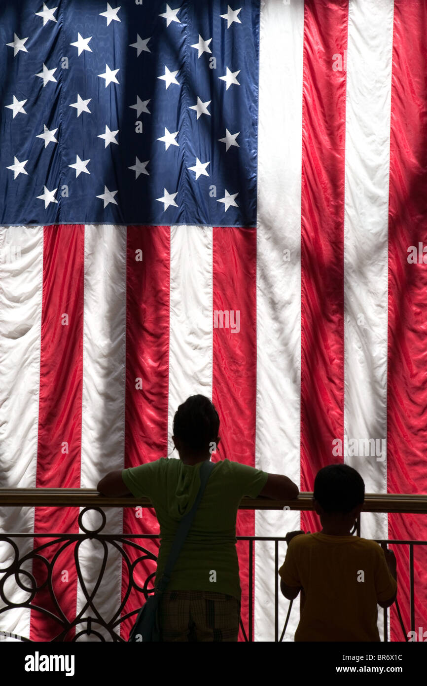 Two children standing with the American Flag, the Venetian Hotel, Las Vegas USA Stock Photo