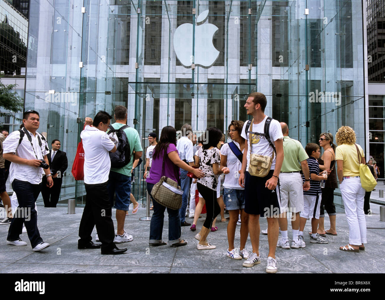 New York City Group of People Outside The Apple Store on Fifth Avenue USA Stock Photo