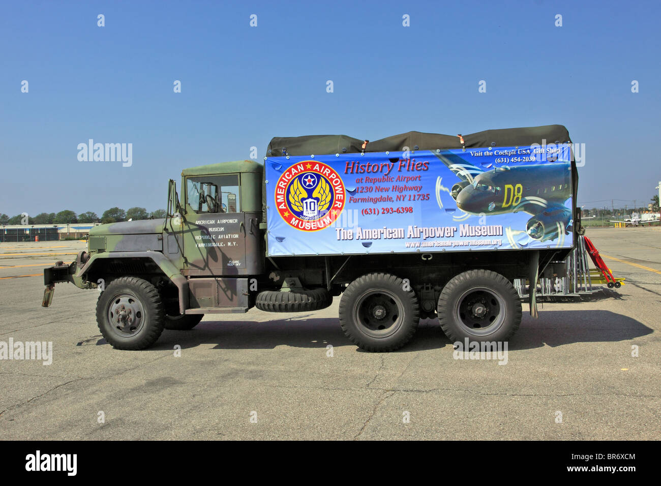 Army truck with American Airpower Museum banner Republic Airport Farmingdale Long Island NY Stock Photo