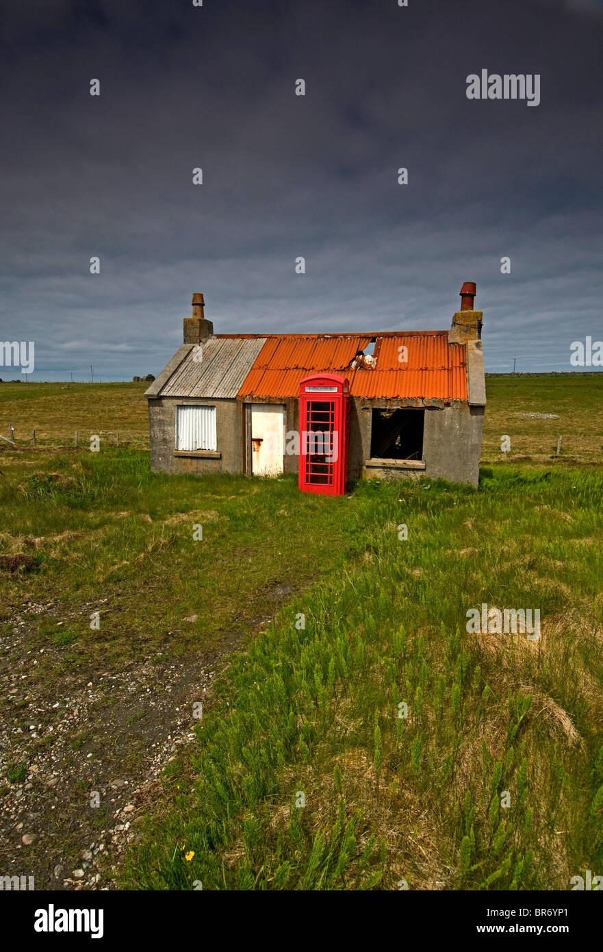 Abandoned and deserted croft house and working public phone box Skigersta. Ness Outer Hebrides in Scotland.  SCO 6664 Stock Photo