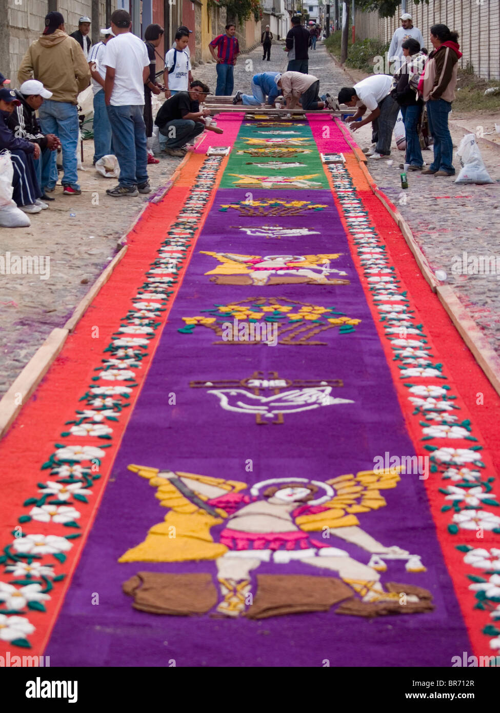 As part of the observance of Lent in Guatemala a group of people prepares an aromatic carpet for a procession in Antigua Guate Stock Photo