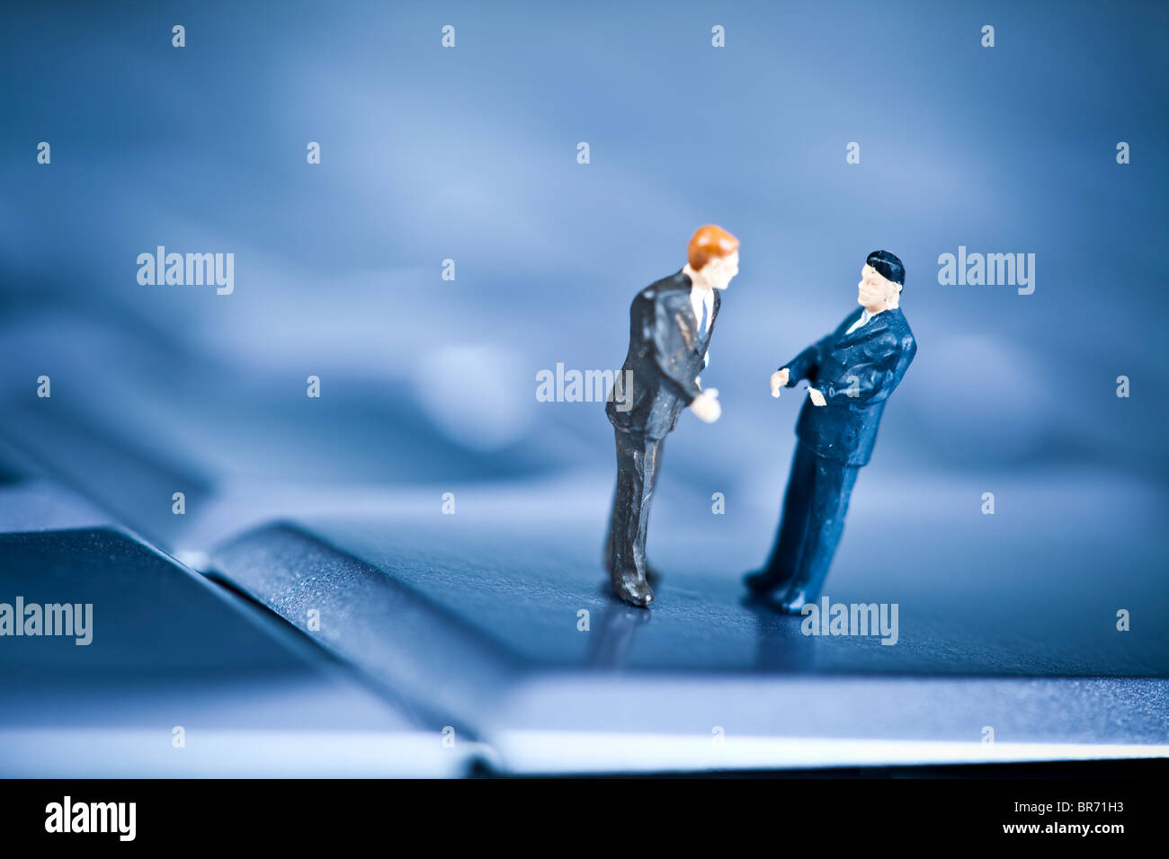 Figure man over computer background Stock Photo - Alamy