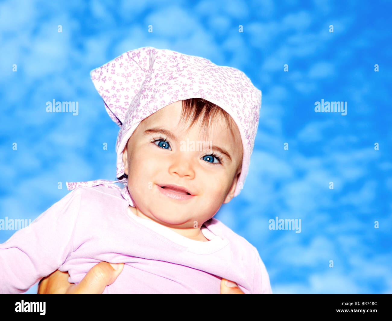 Little girl closeup portrait over blue sky Stock Photo - Alamy