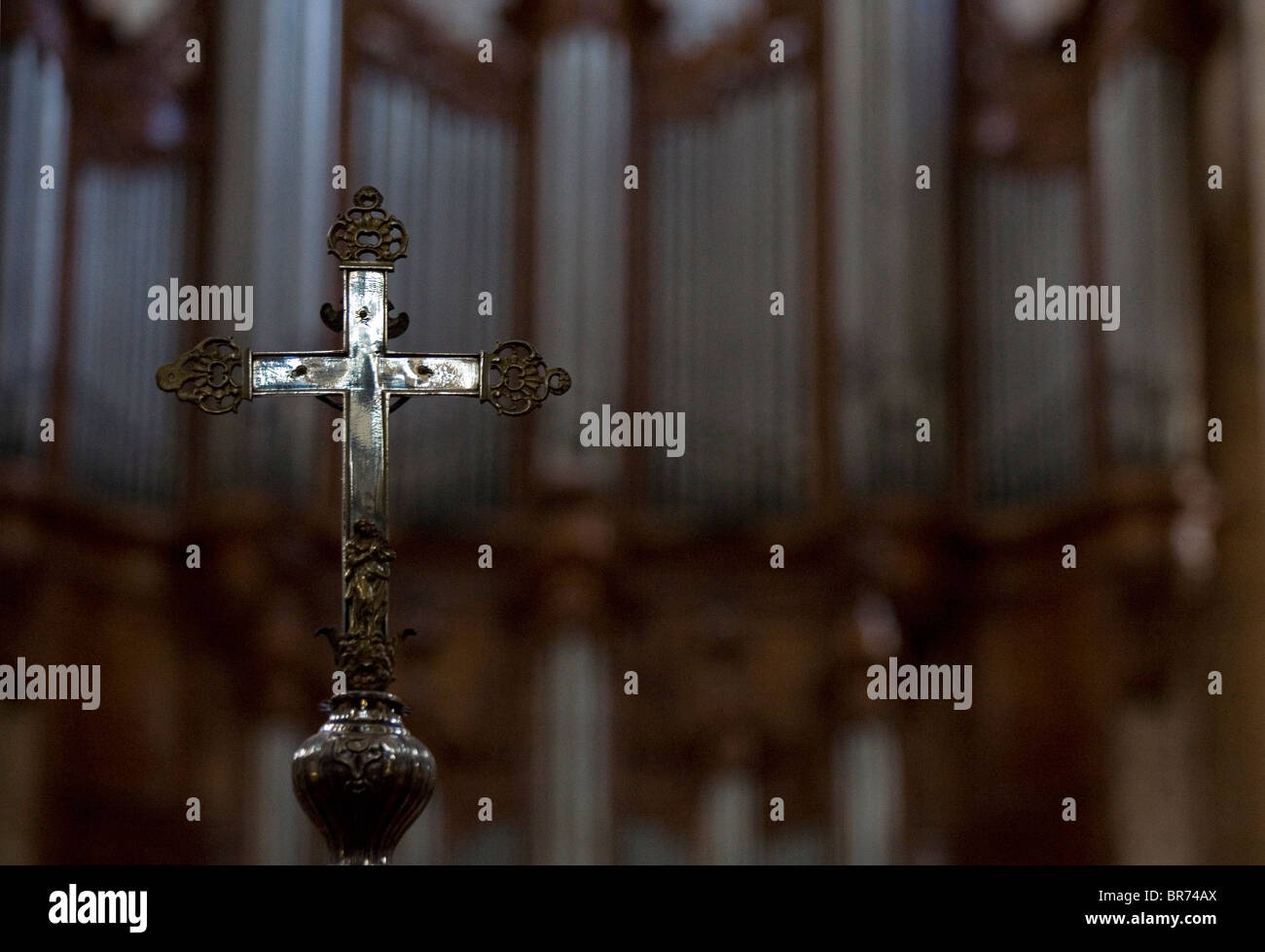 Cross infront of a large organ in Saint Maximin France. Stock Photo