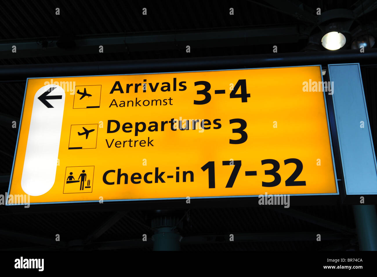 Direction sign in a terminal of Schiphol Airport, Amsterdam, Netherlands Stock Photo