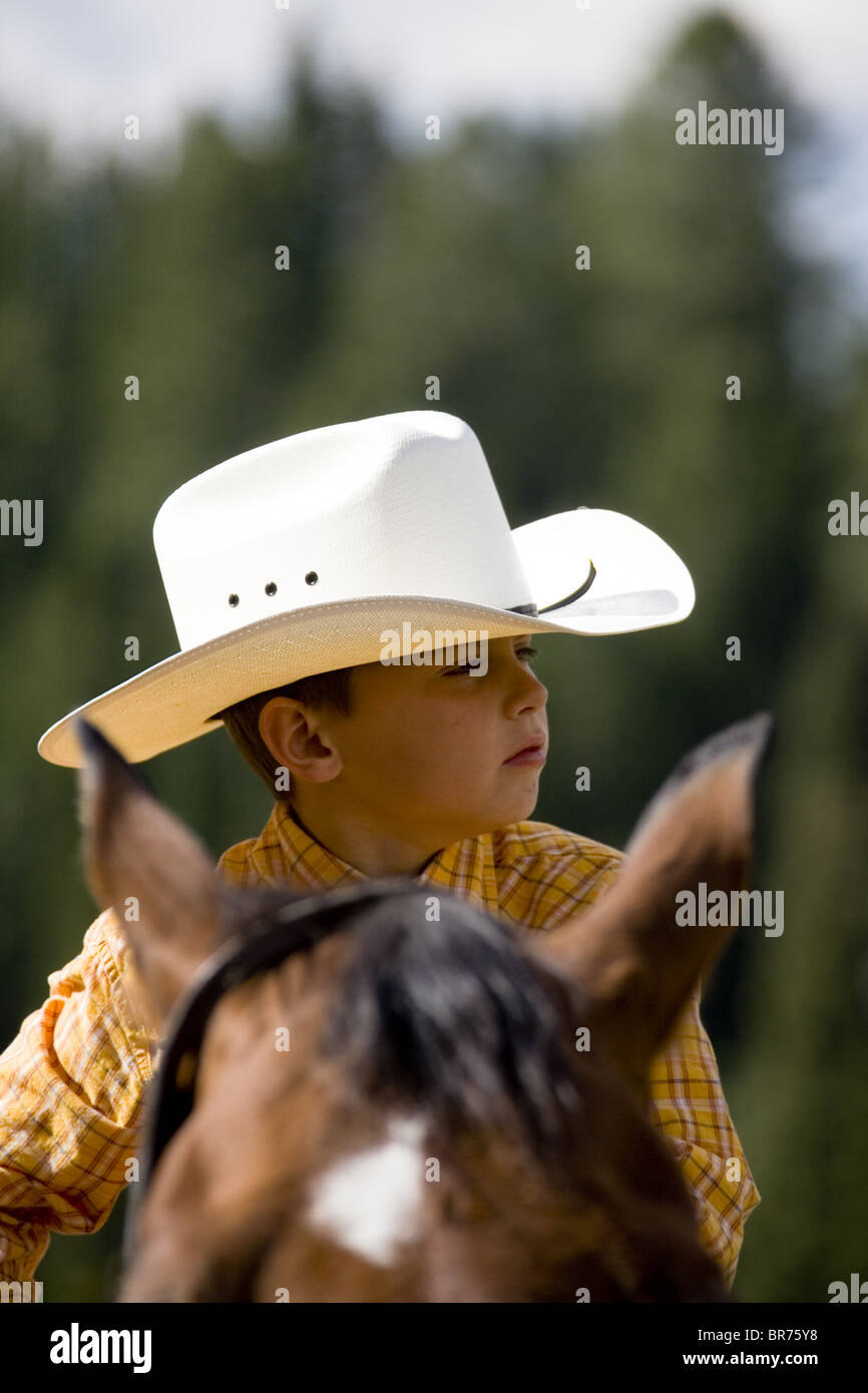 Young cow boy on horse Wyoming Stock Photo