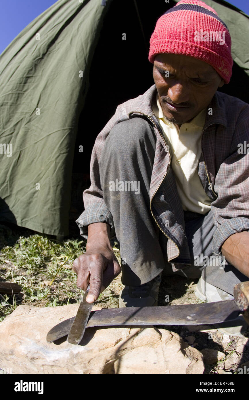 Local man sharpening knife India Stock Photo Alamy