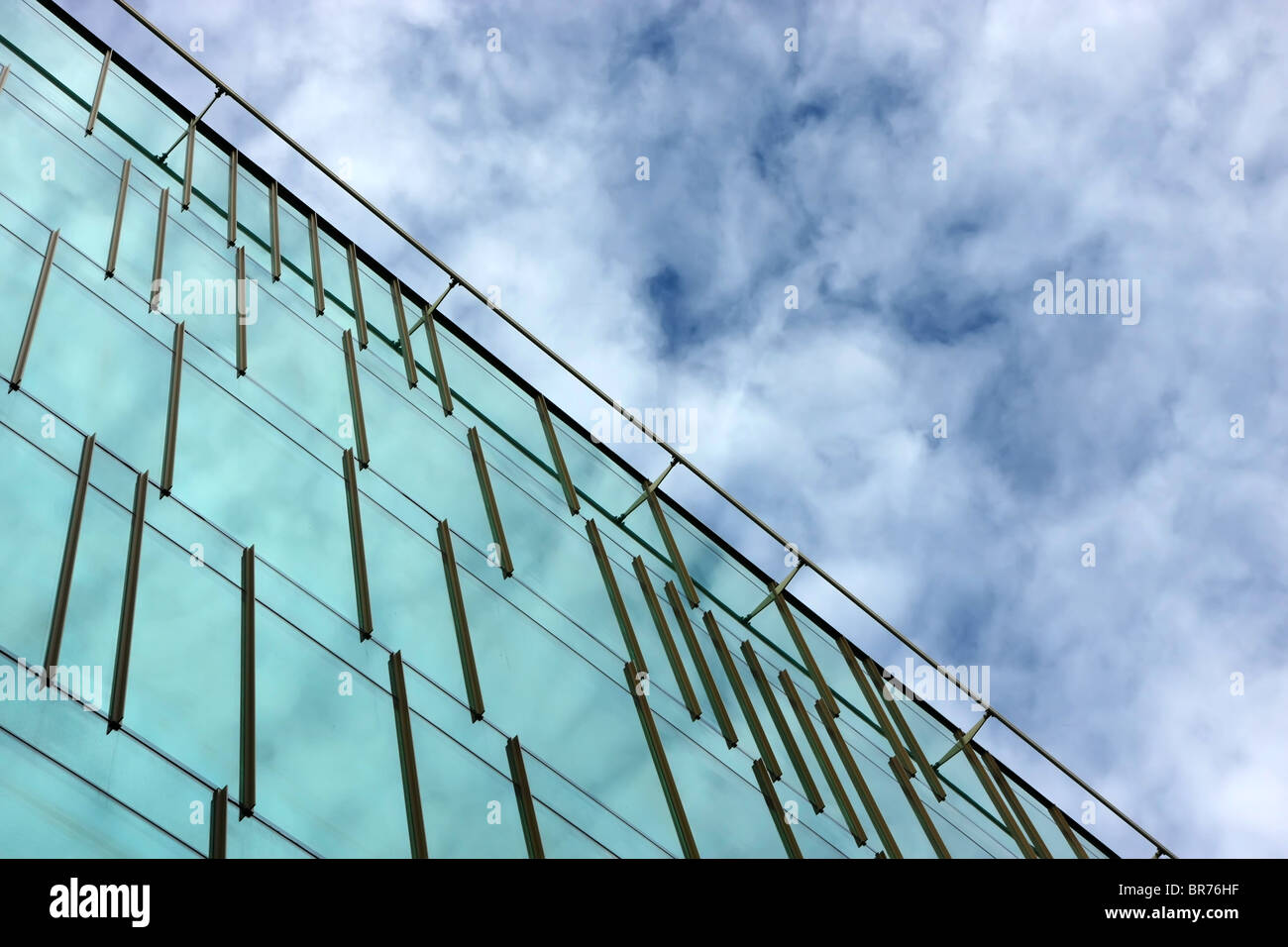 Part of an office building facade reflecting the sky and clouds Stock ...