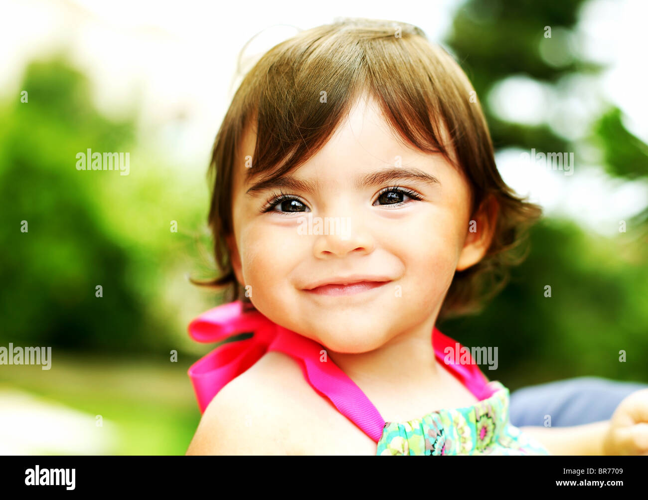 Little girl smiling, closeup portrait outdoors Stock Photo - Alamy