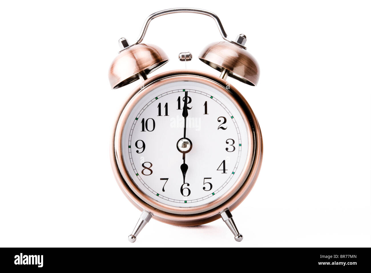 Copper alarm clock showing 6 o'clock Stock Photo