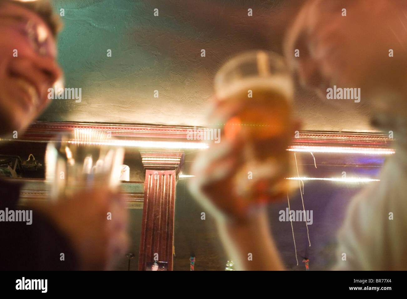 Friends go out and have a few beers at a bar in Cambridge boston. Stock Photo