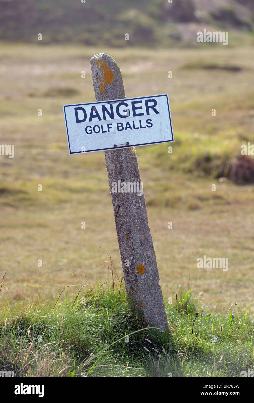 DANGER GOLF BALLS WARNING SIGN ON A BRITISH GOLF COURSE UK Stock Photo