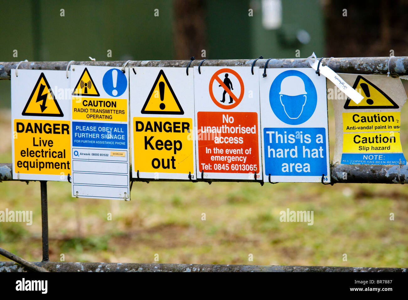 Hazard warning signs around radio transmitter Stock Photo