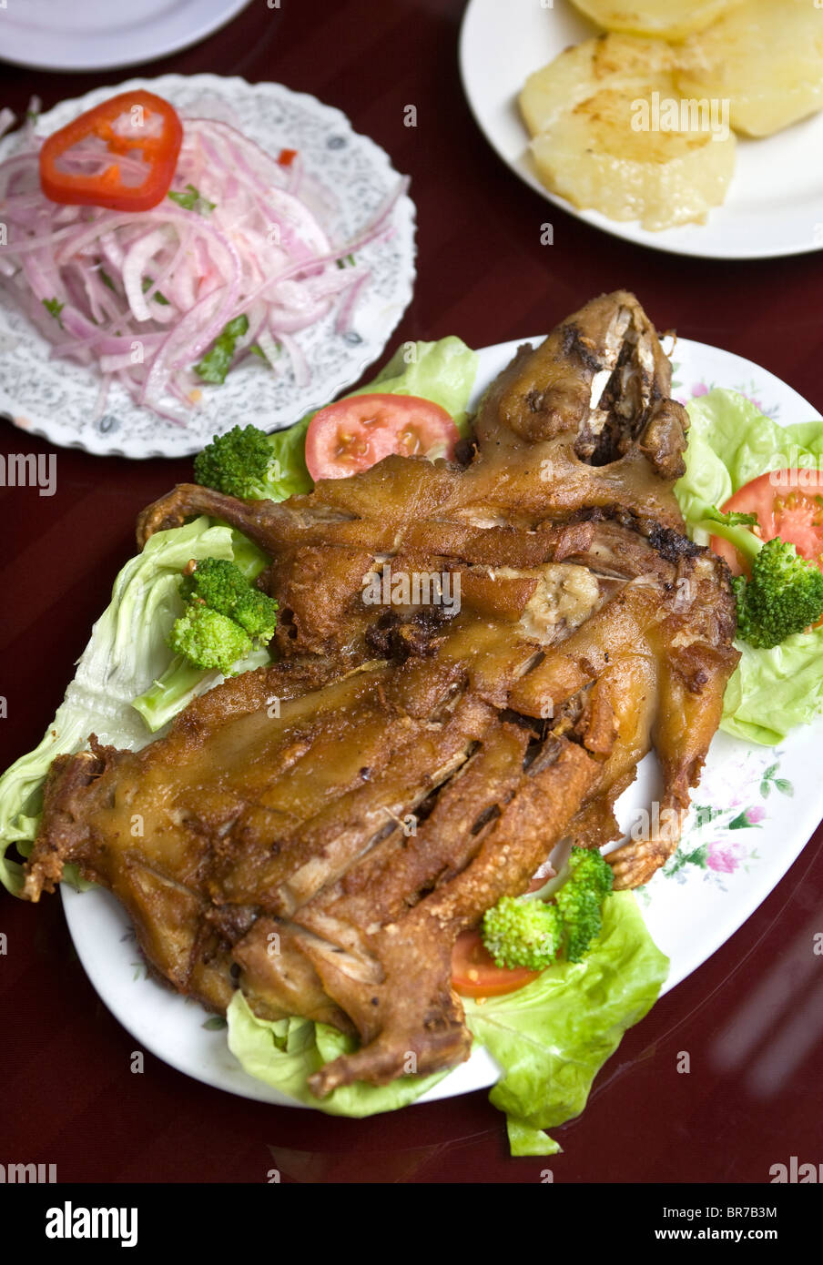 Roast Cuy or Guinea Pig served in a restaurant in Lima Peru -  An example of the strange or weird food eaten by people around the world Stock Photo