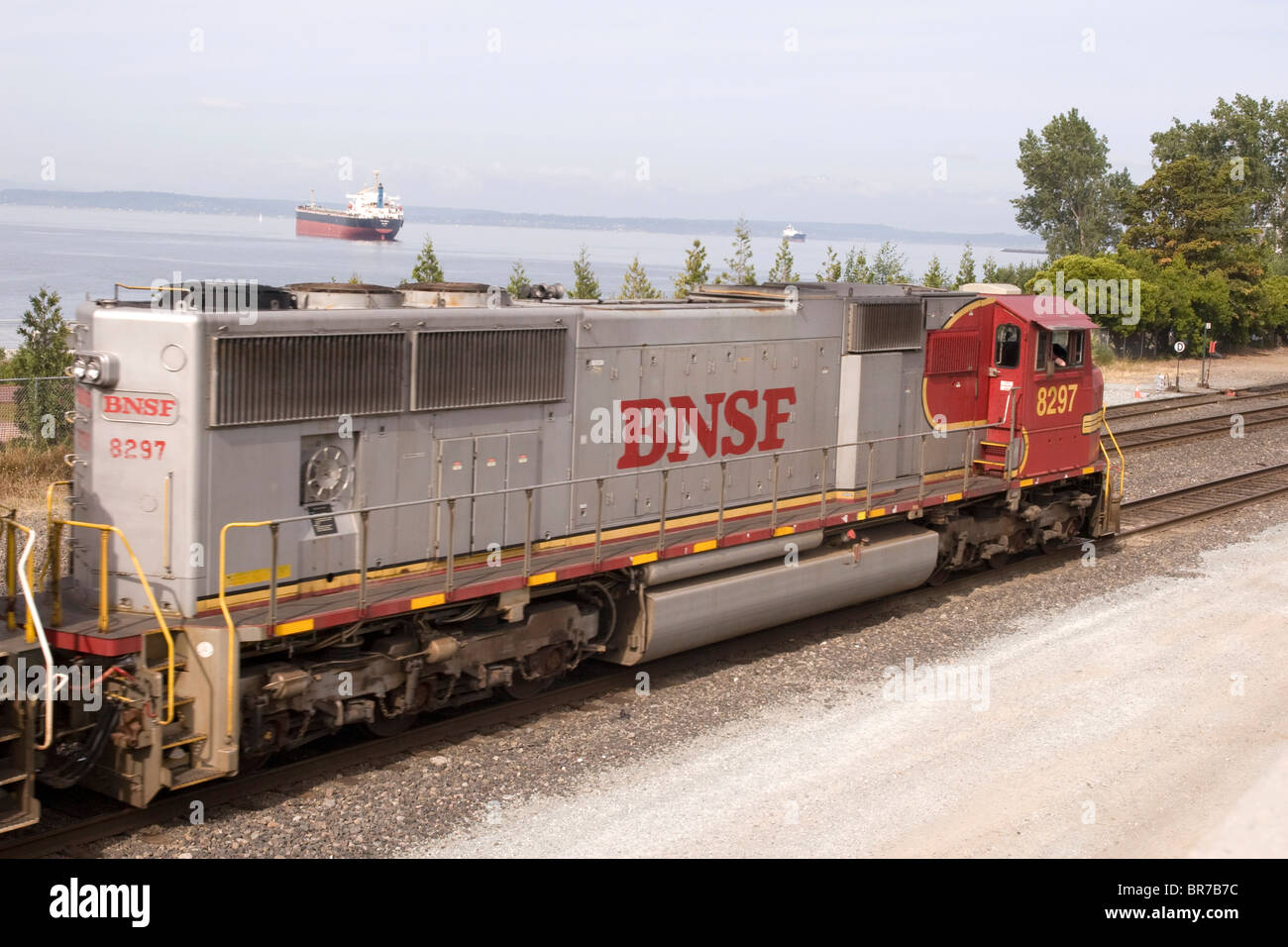 Burlington Northern Santa Fe BNSF diesel locomotive passes the Olympic Sculpture Park in Seattle WA USA Stock Photo