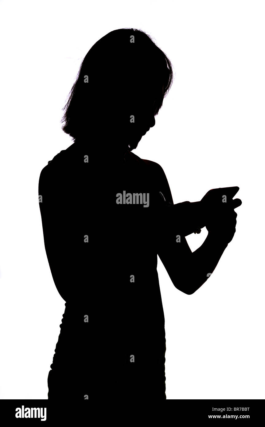 silhouette of teen girl with iphone Stock Photo - Alamy