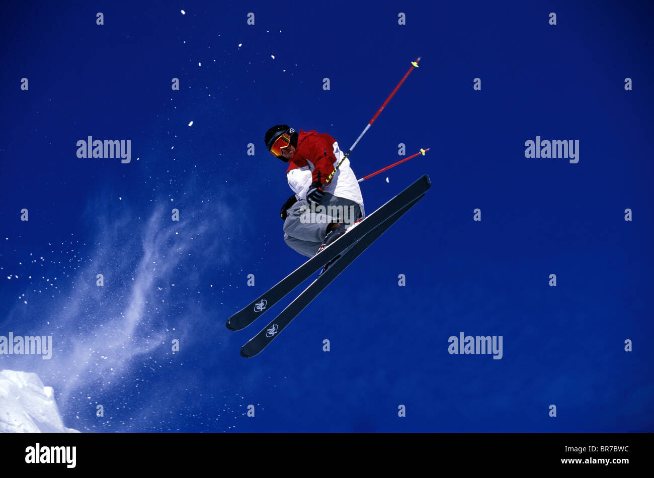 Male freeskier launching into the air backwards in Lake Tahoe California. Stock Photo