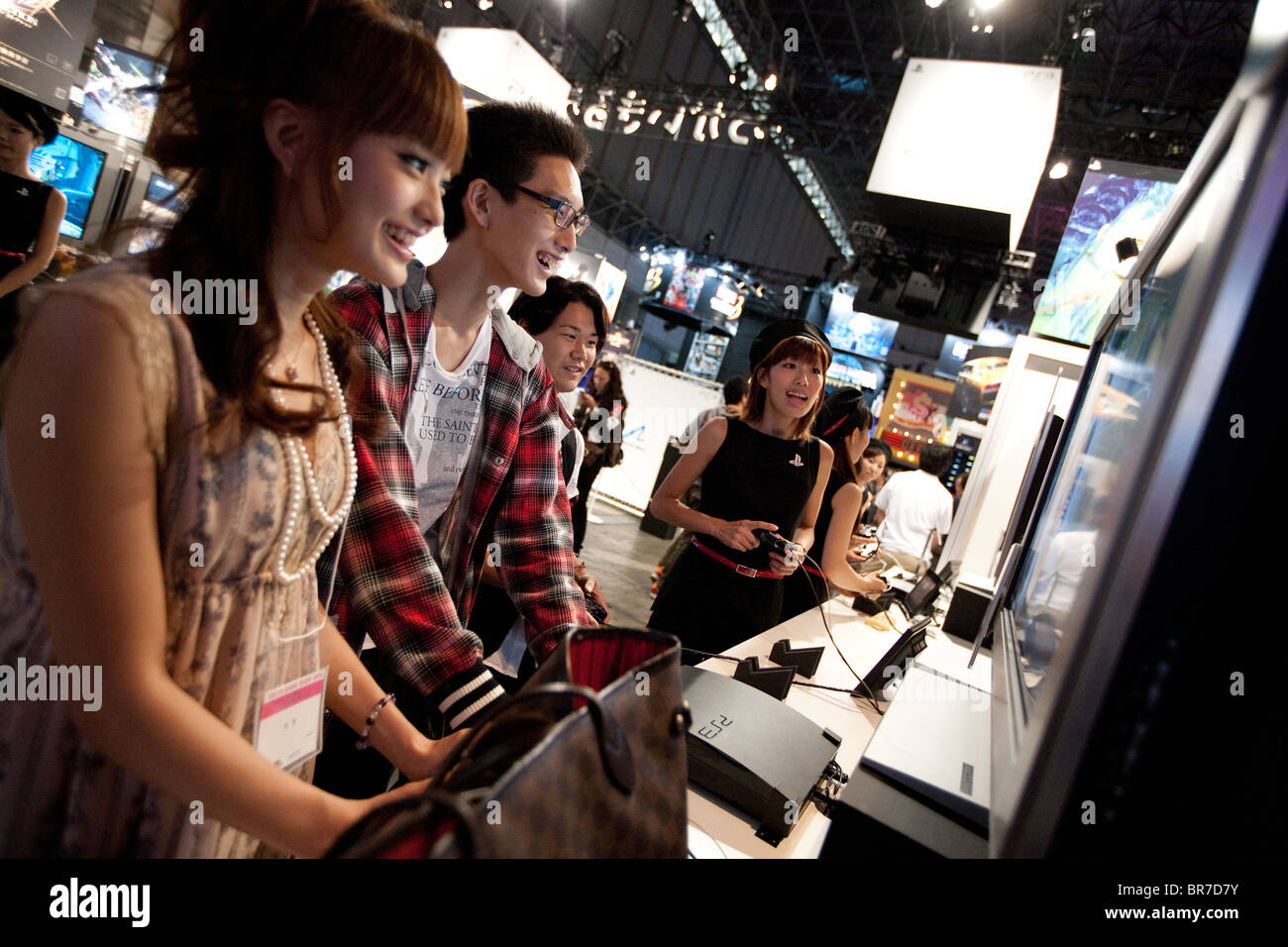 Computer gamers try new games at the trade stalls of various game