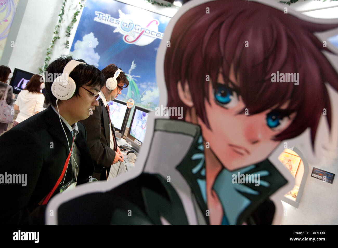 Computer gamers try new games at the trade stalls of various game