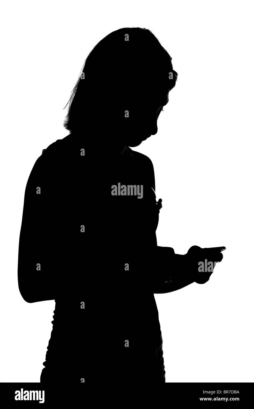 silhouette of teen girl with iphone Stock Photo - Alamy
