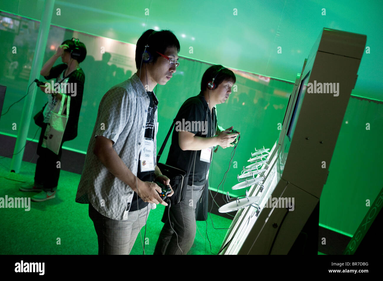 Computer gamers try new games at the trade stalls of various game manufacturing companies at the 2010 Tokyo Games Show. Stock Photo