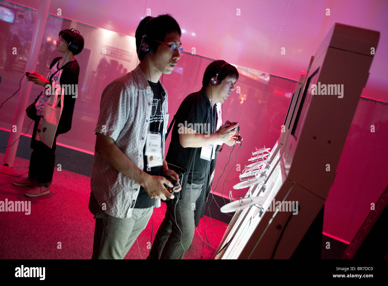 Computer gamers try new games at the trade stalls of various game manufacturing companies at the 2010 Tokyo Games Show. Stock Photo