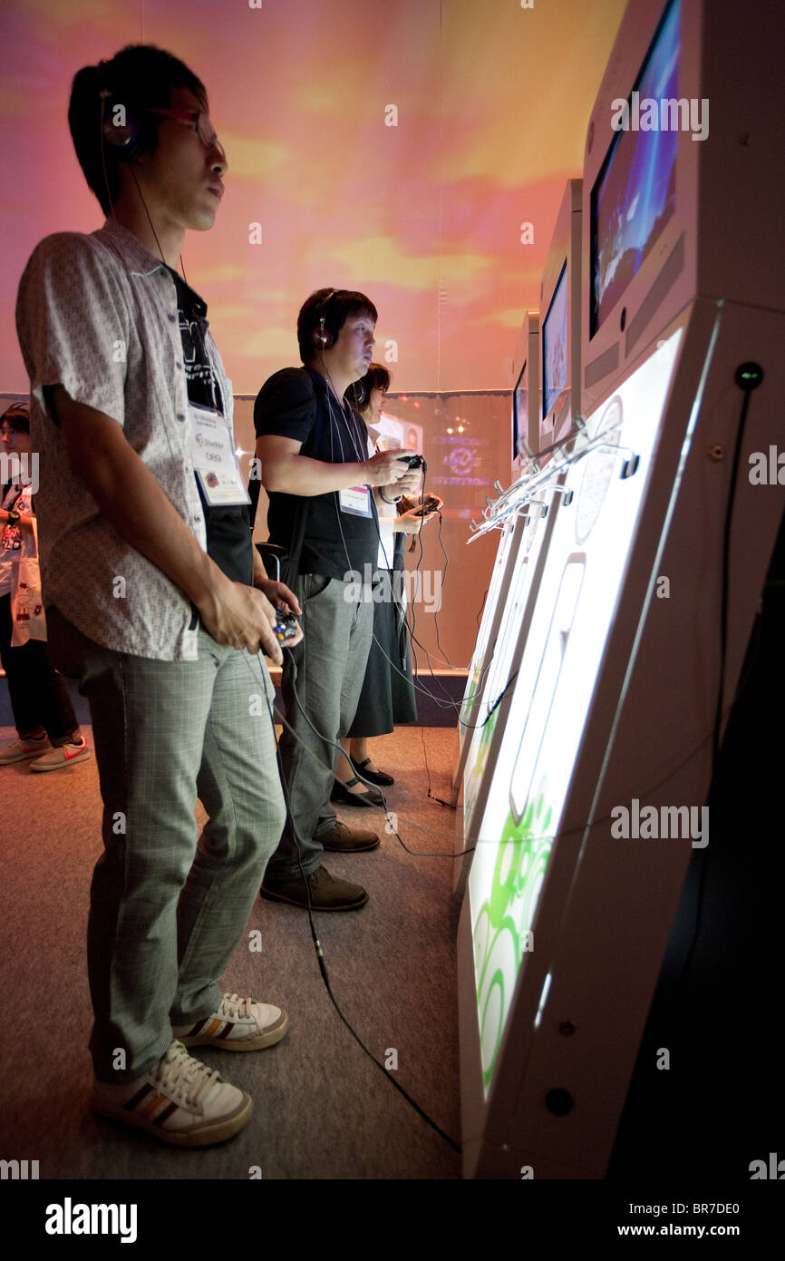 Computer gamers try new games at the trade stalls of various game manufacturing companies at the 2010 Tokyo Games Show. Stock Photo