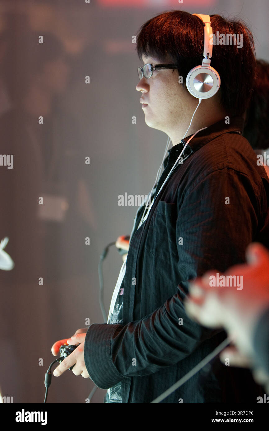 Computer gamers try new games at the trade stalls of various game manufacturing companies at the 2010 Tokyo Games Show. Stock Photo