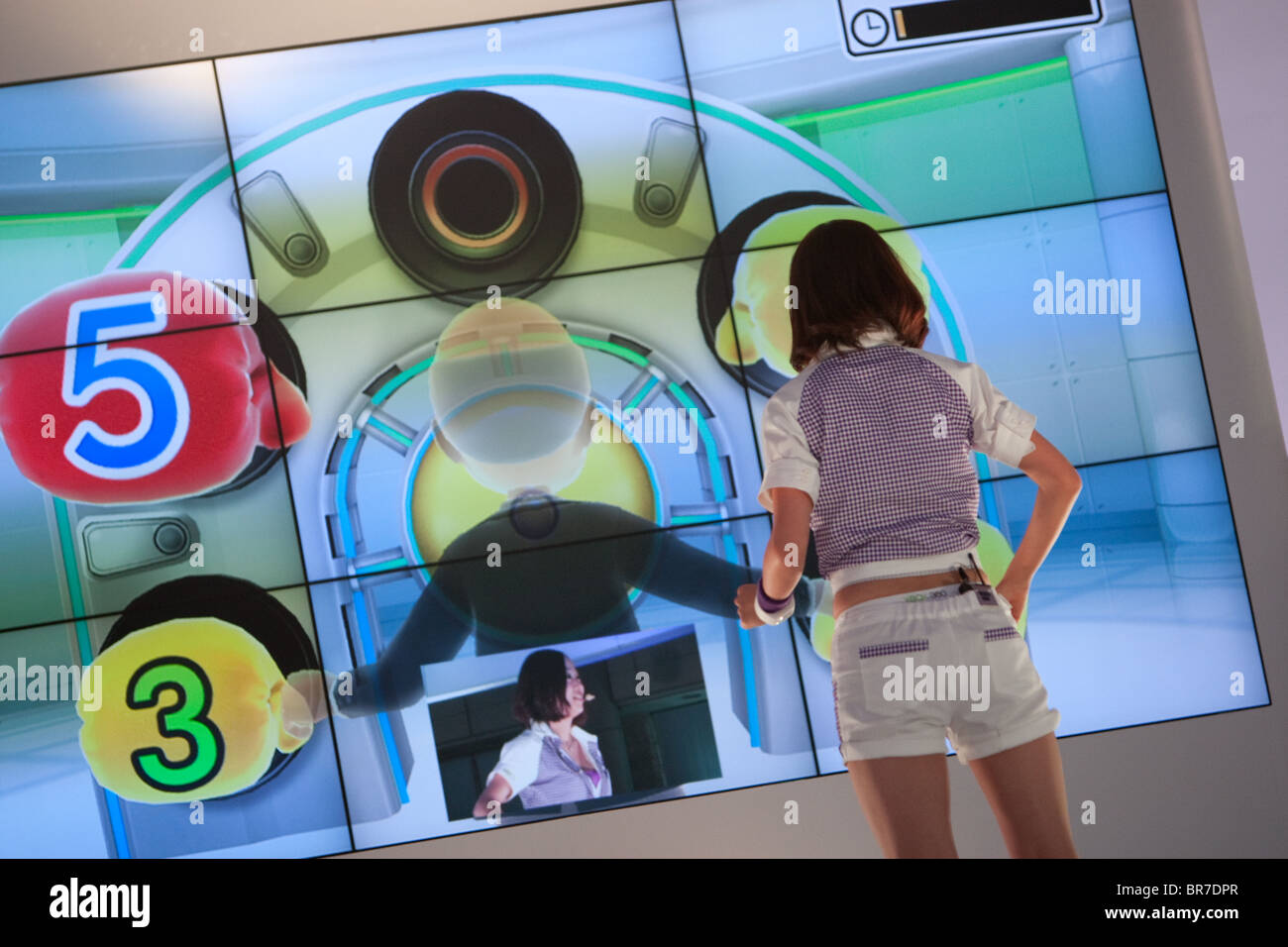 Computer gamers try new games at the trade stalls of various game