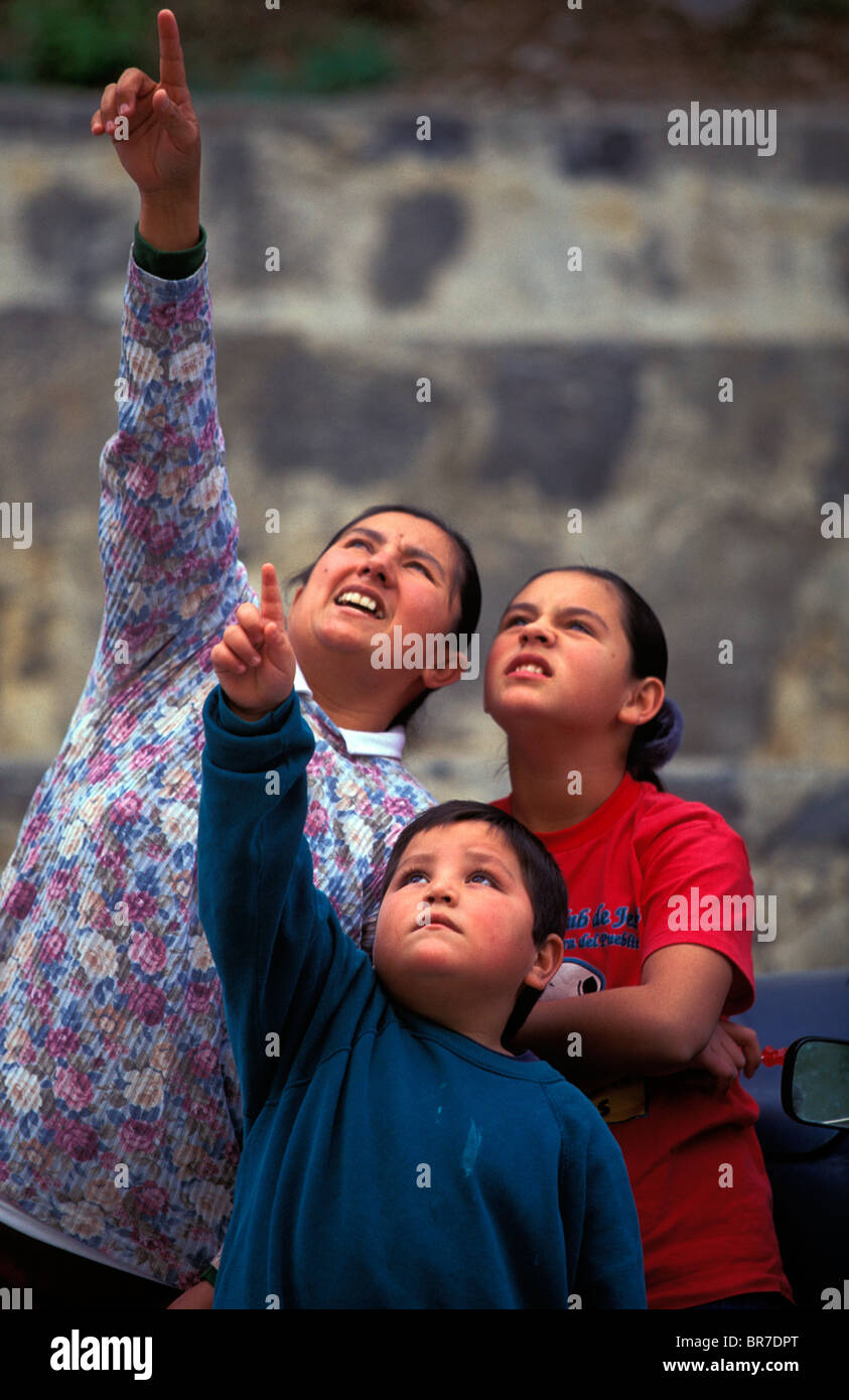Local villagers look up and point as they watch climbers at El Potrero Chico Mexico. Stock Photo