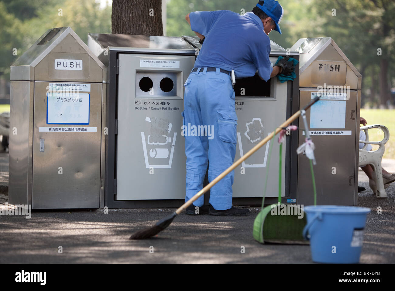 Cleaning the refuse garbage bins, in Yamashita Park, Yokohama, Japan