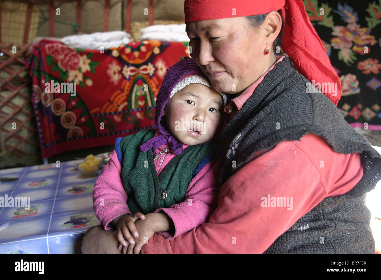 Mother and child in a yurt Stock Photo