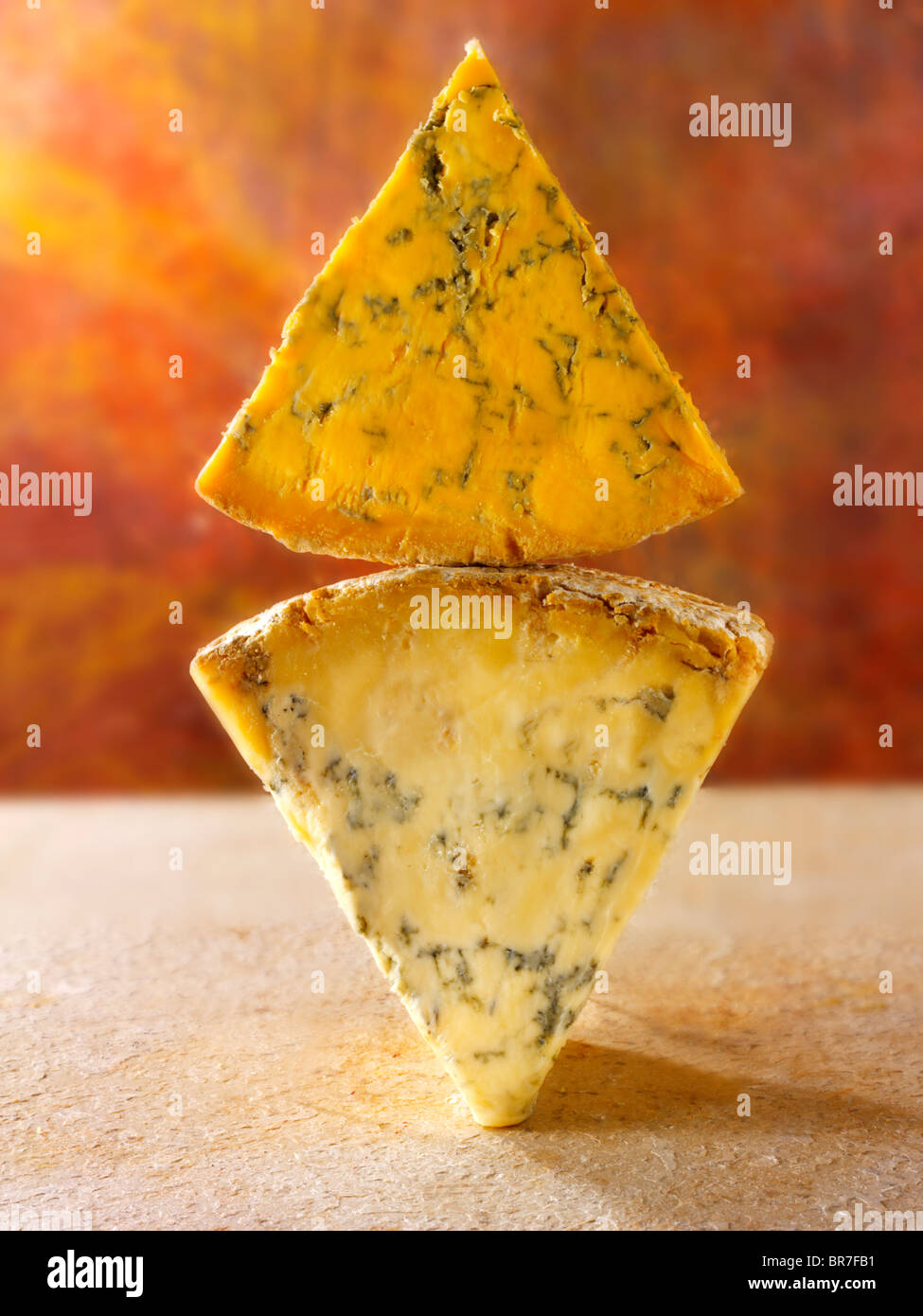 English blue cheese wedges - stilton, white stilton amd blacksticks Stock Photo