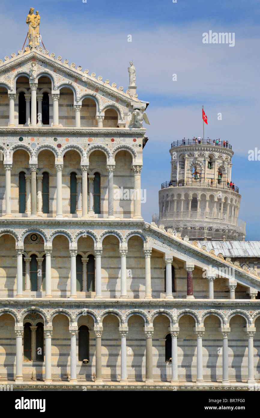 The Duomo with the iconic Leaning Tower behind it, in Pisa's Square of MIracles, Italy Stock Photo