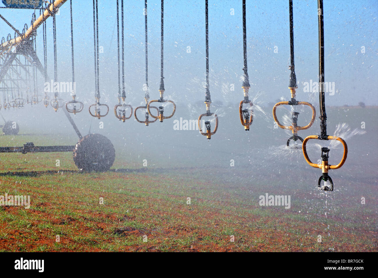 Center pivot crop irrigation system with water sprinklers Stock Photo