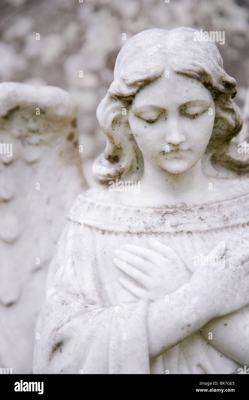 Detail view of a small angel sculpture at a cemetery Stock Photo Alamy