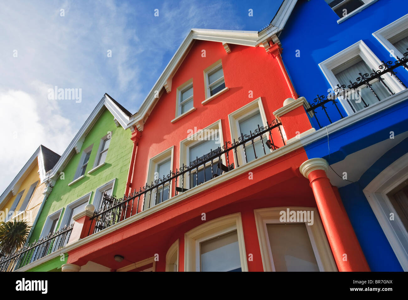 Brightly coloured housing on the beachfront at Whitehead, a popular resort on the Irish Sea in County Antrim, Northern Ireland Stock Photo