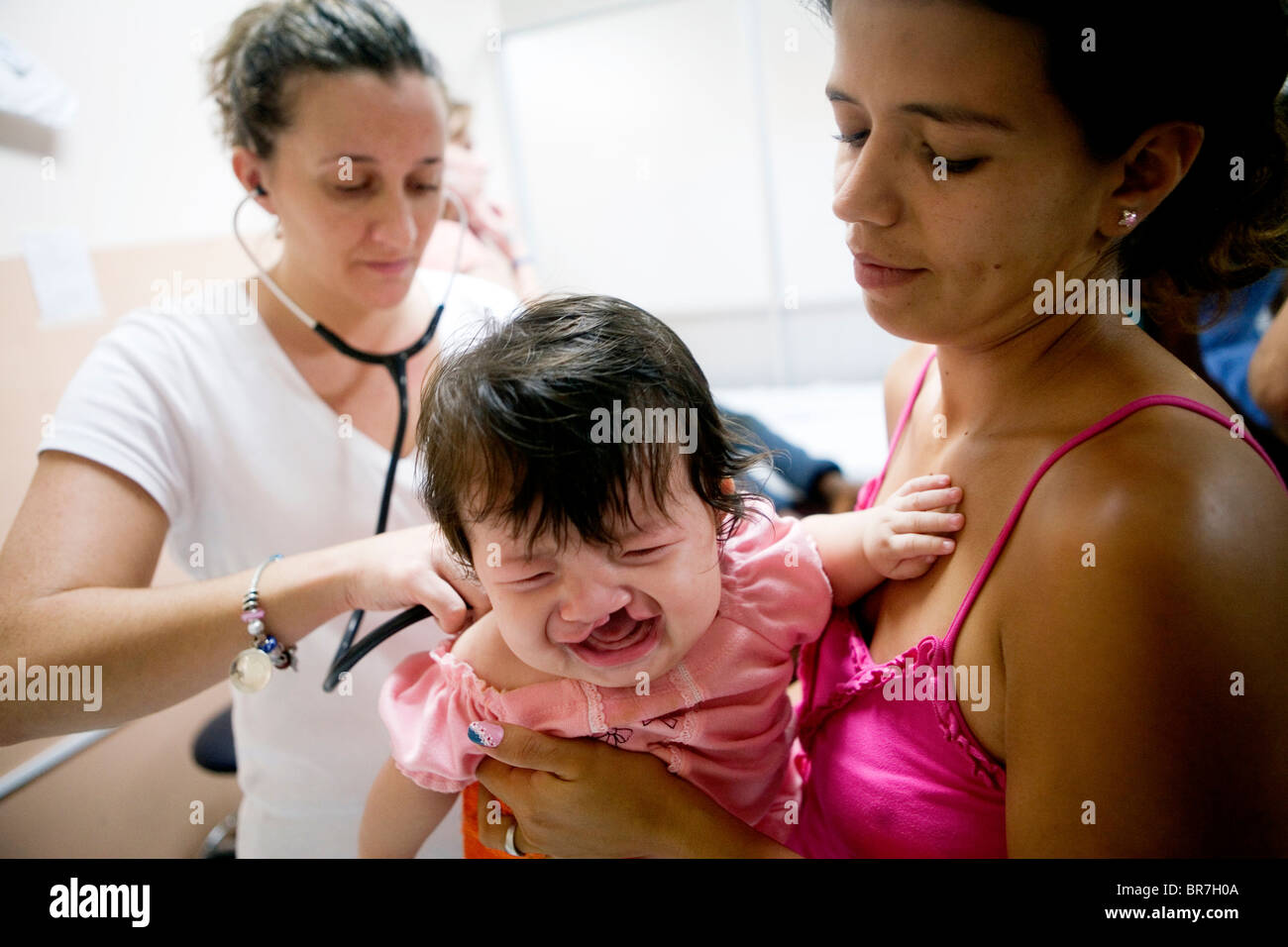 An American nurse examines a baby with a cleft lip and palate in ...