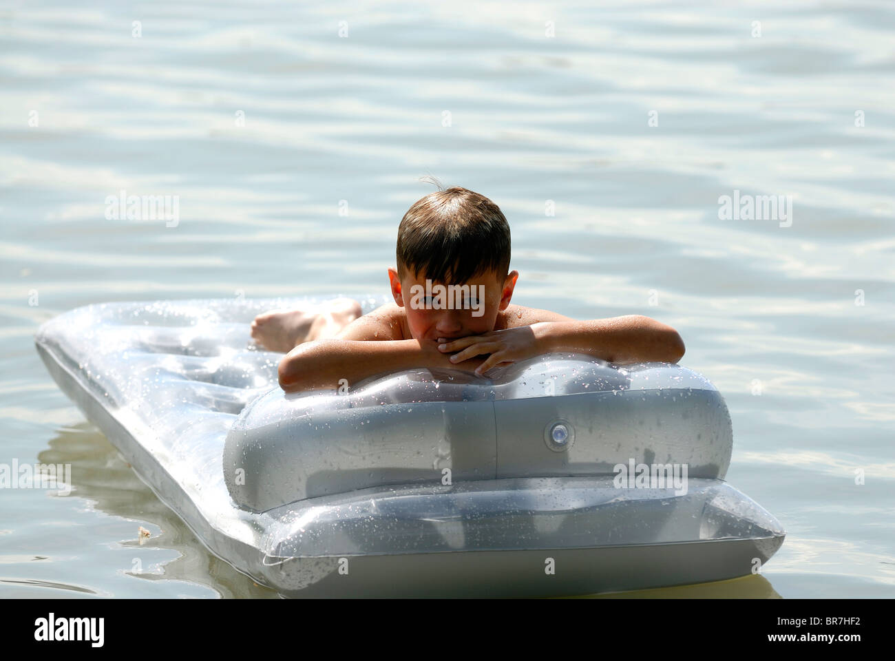 Lazy Boy relaxing on a Pool Raft Stock Photo - Alamy