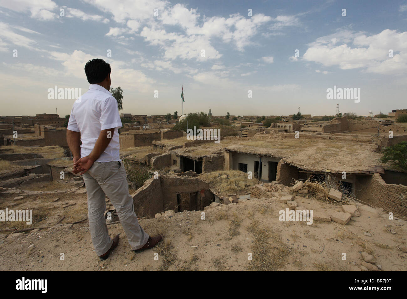 A Kurdish man gazing at the old Kalaa citadel in the city of Erbil also spelled Arbil or Irbil the capital city of Kurdistan Region in northern Iraq. Stock Photo