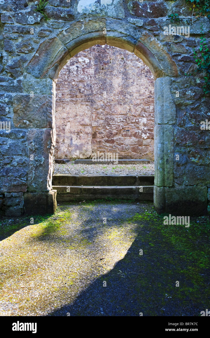 Arched doorway leading into the main hall of Dungiven Priory, County Londonderry, Northern Ireland Stock Photo