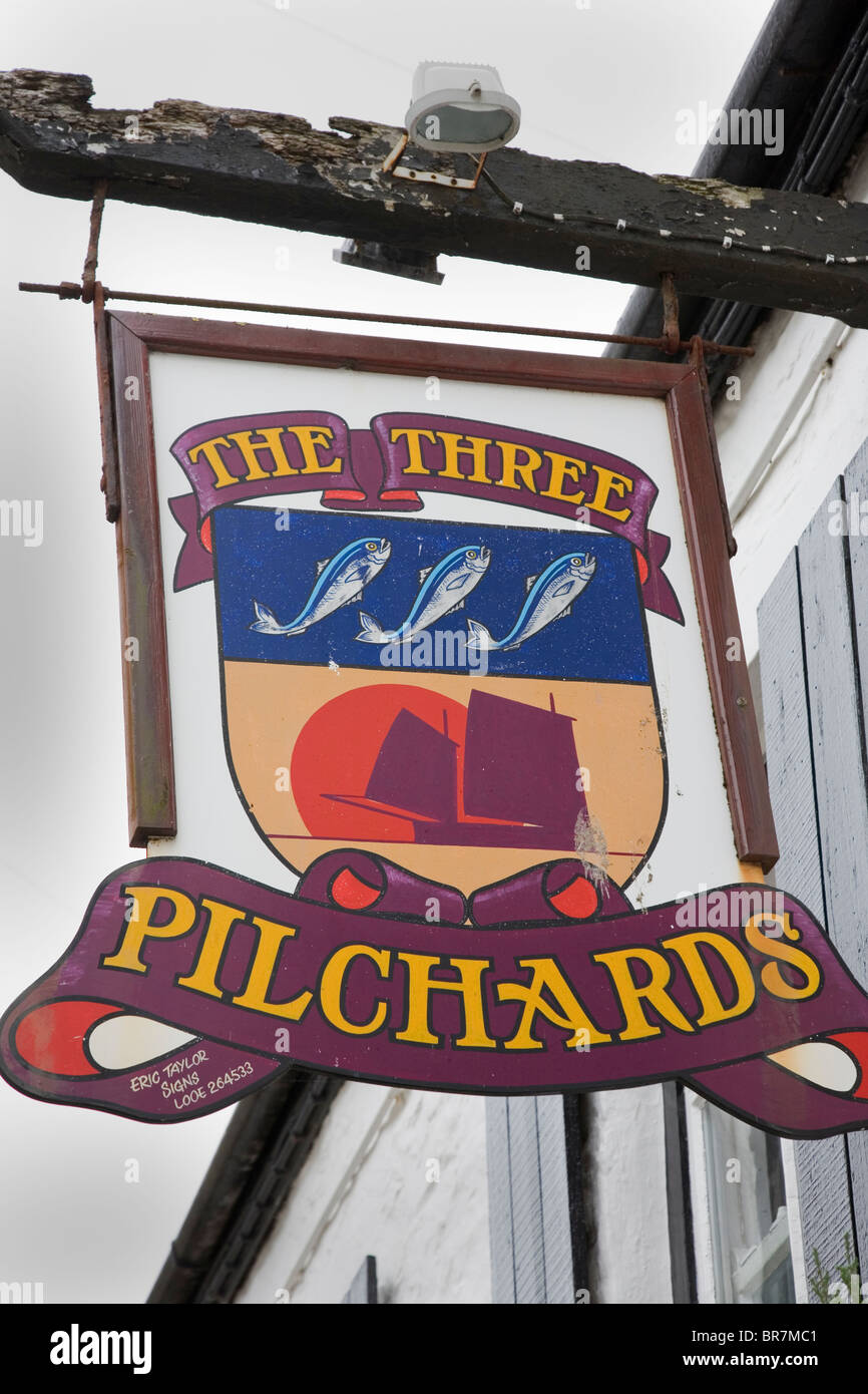 'The Three Pilchards' an unusual pub sign in the small Cornish Fishing village of Polperro, Cornwall, UK Stock Photo