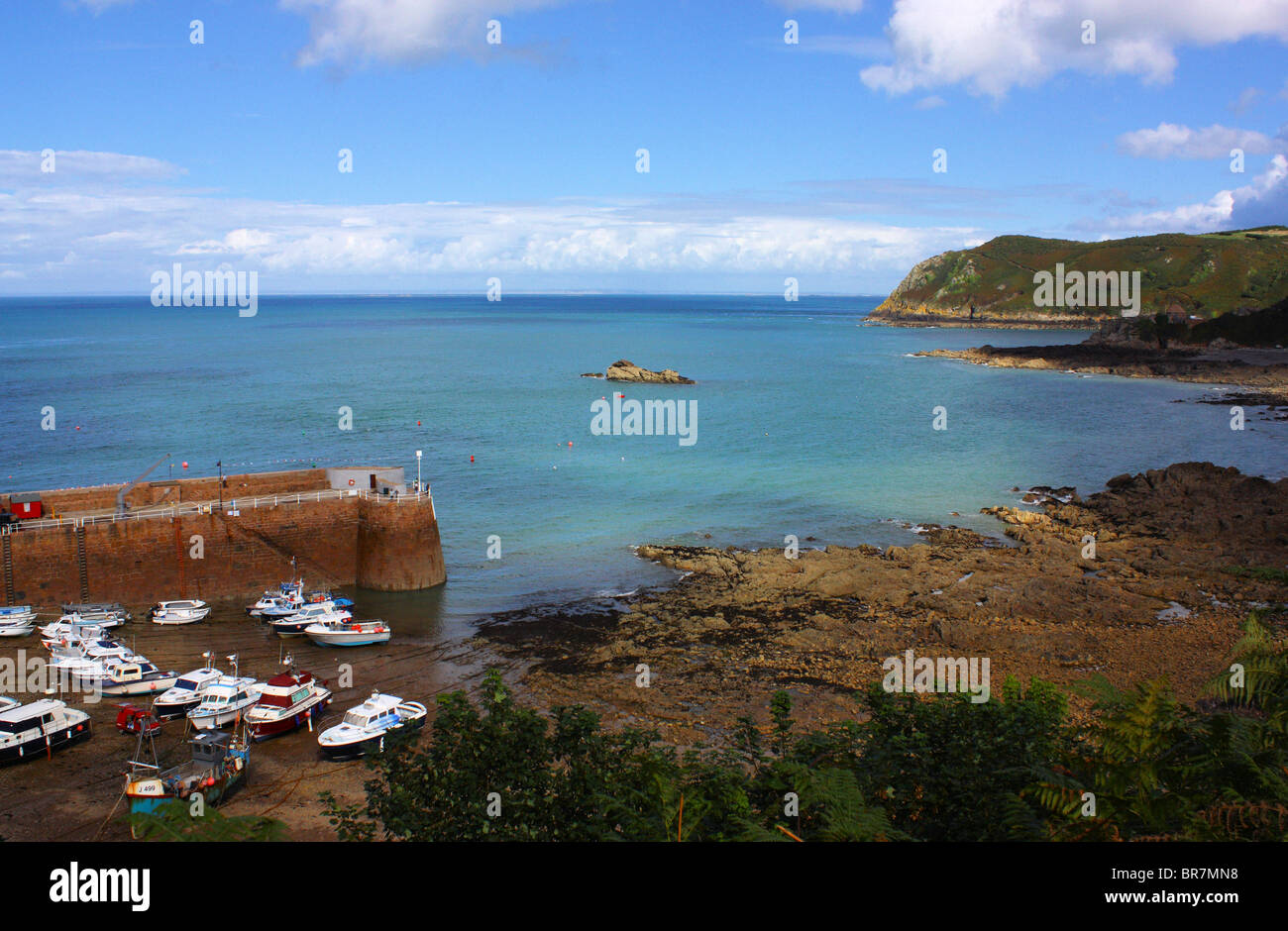 St Rozels Bay Rozel Bay, Jersey North Coast. The sea is calm and very blue, almost ...