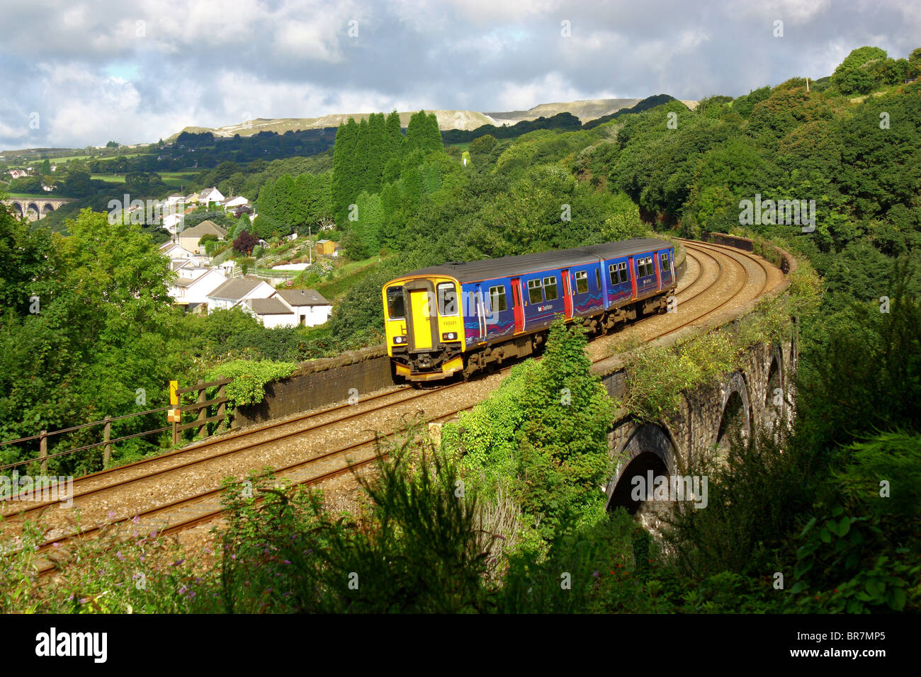 Two carriage train crossing St Austell (Cornwall)  viaduct. Travel direction is into the picture. Stock Photo