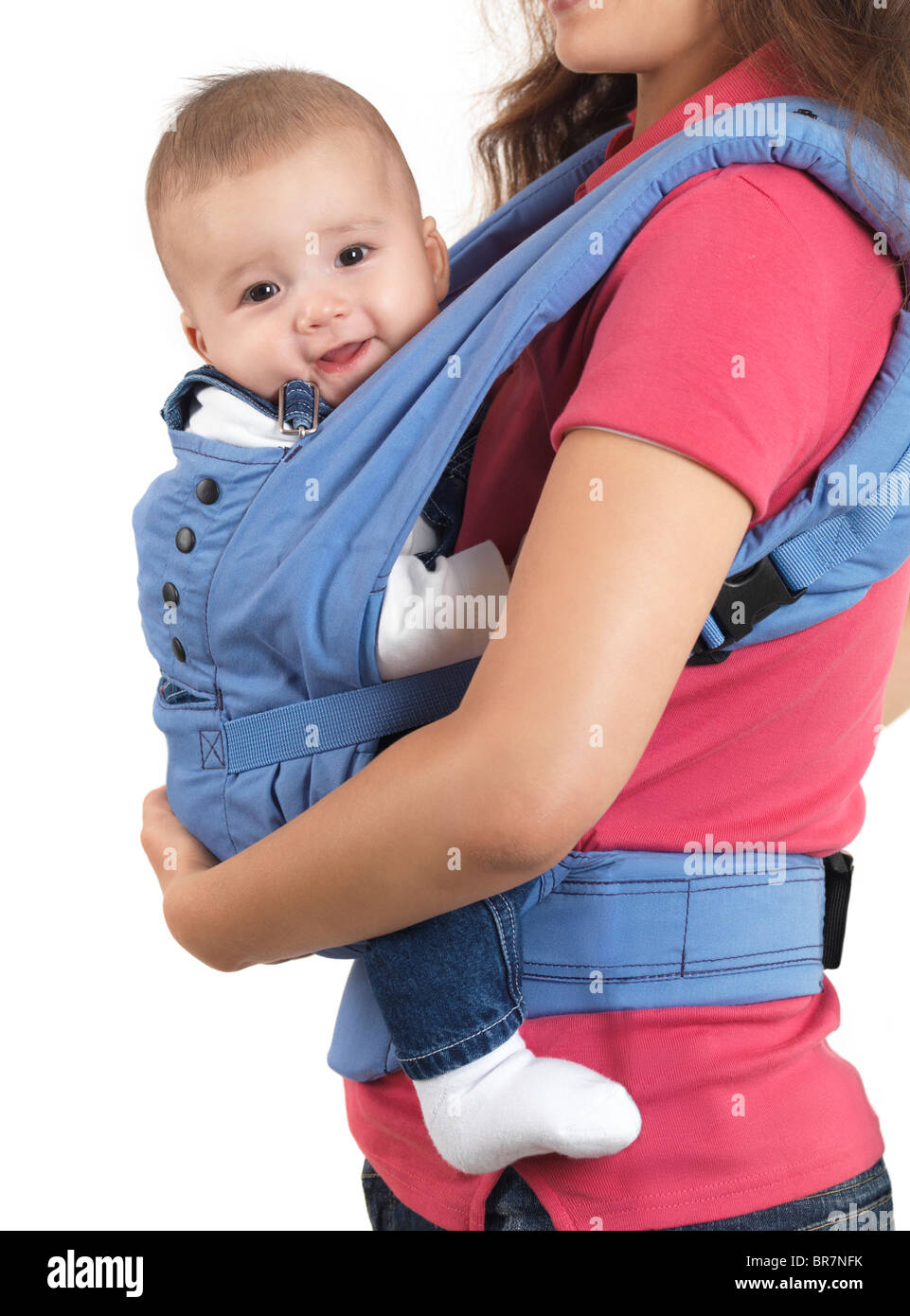 Mother with a four month old baby boy in a carrier. Isolated on white background. Stock Photo