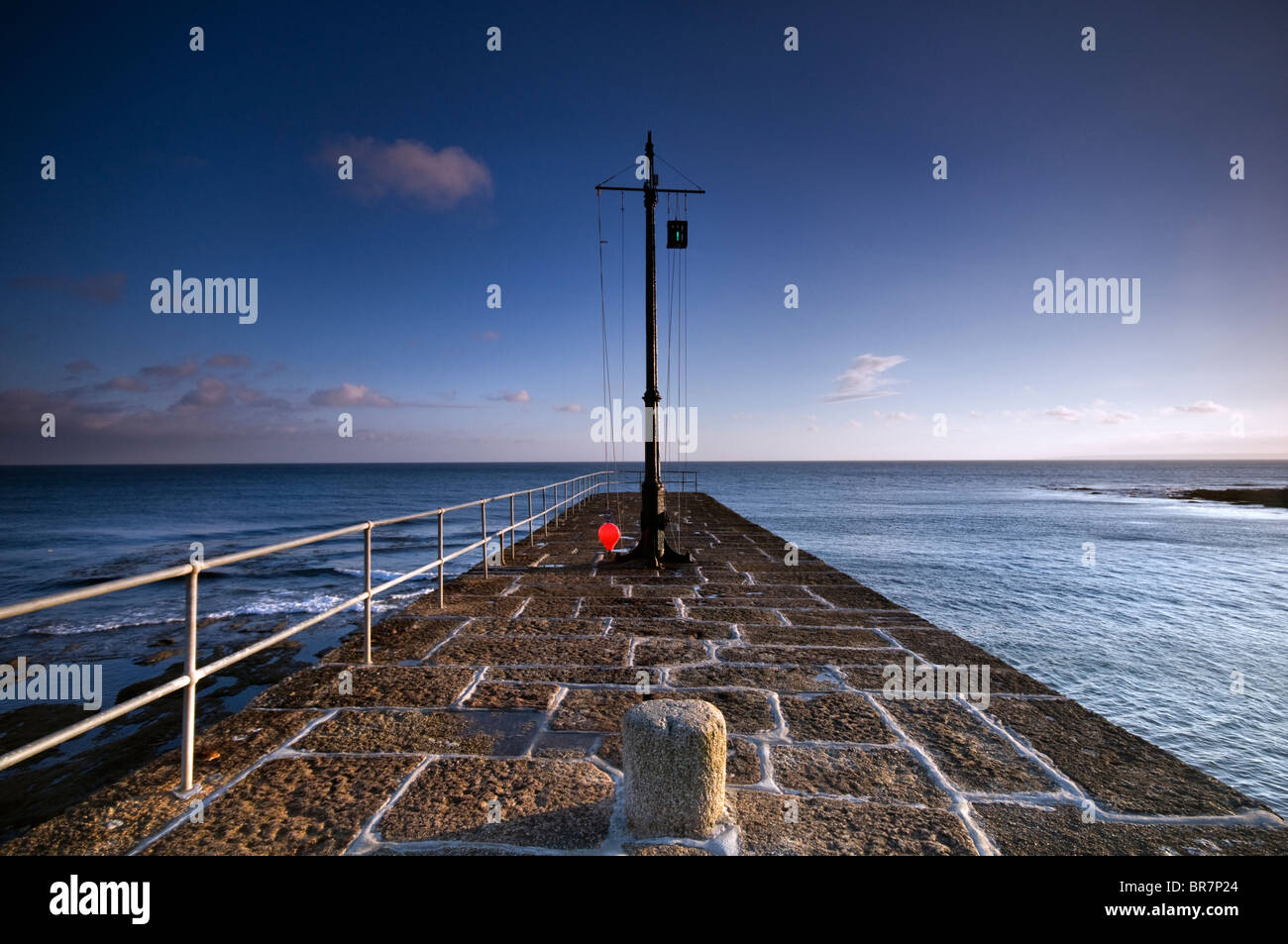 The top of the harbour wall at the fishing village of Porthleven in Cornwall, England, UK Stock Photo