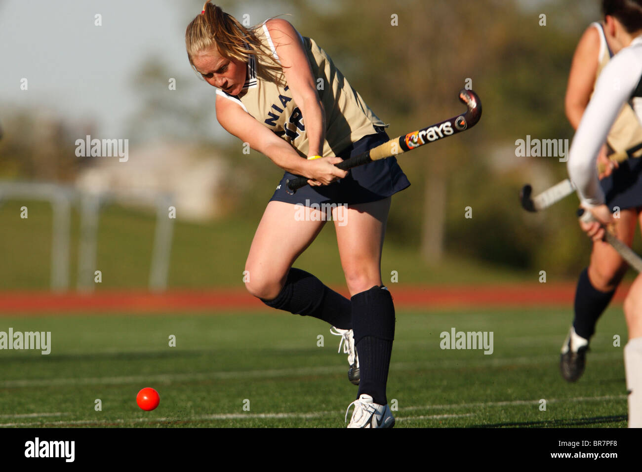 A Juniata College player cracks a shot against Catholic University during the Landmark Conference field hockey championship. Stock Photo
