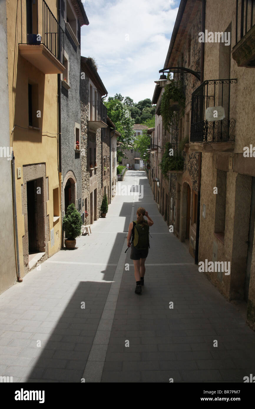 Woman tourist model released in Medieval Santa Pau in the Volcanic Zone National Park near Olot in La Alta Garrotxa Catalonia Spain Stock Photo